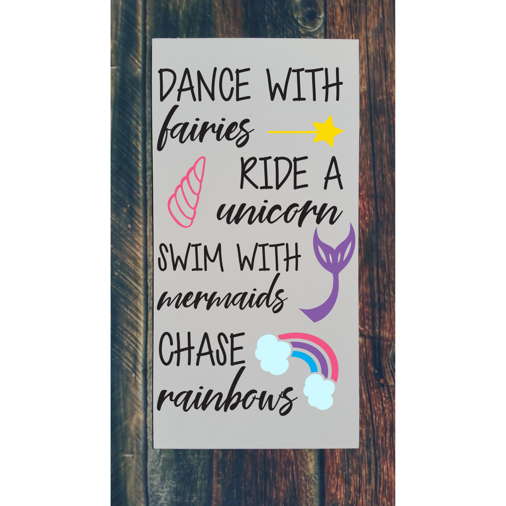 "Dance with fairies ride a unicorn swim with mermaids chase rainbows“ with wand, unicorn horn, mermaid tail, and rainbow on 12x24 board